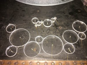 Two of the designs cut in acrylic 